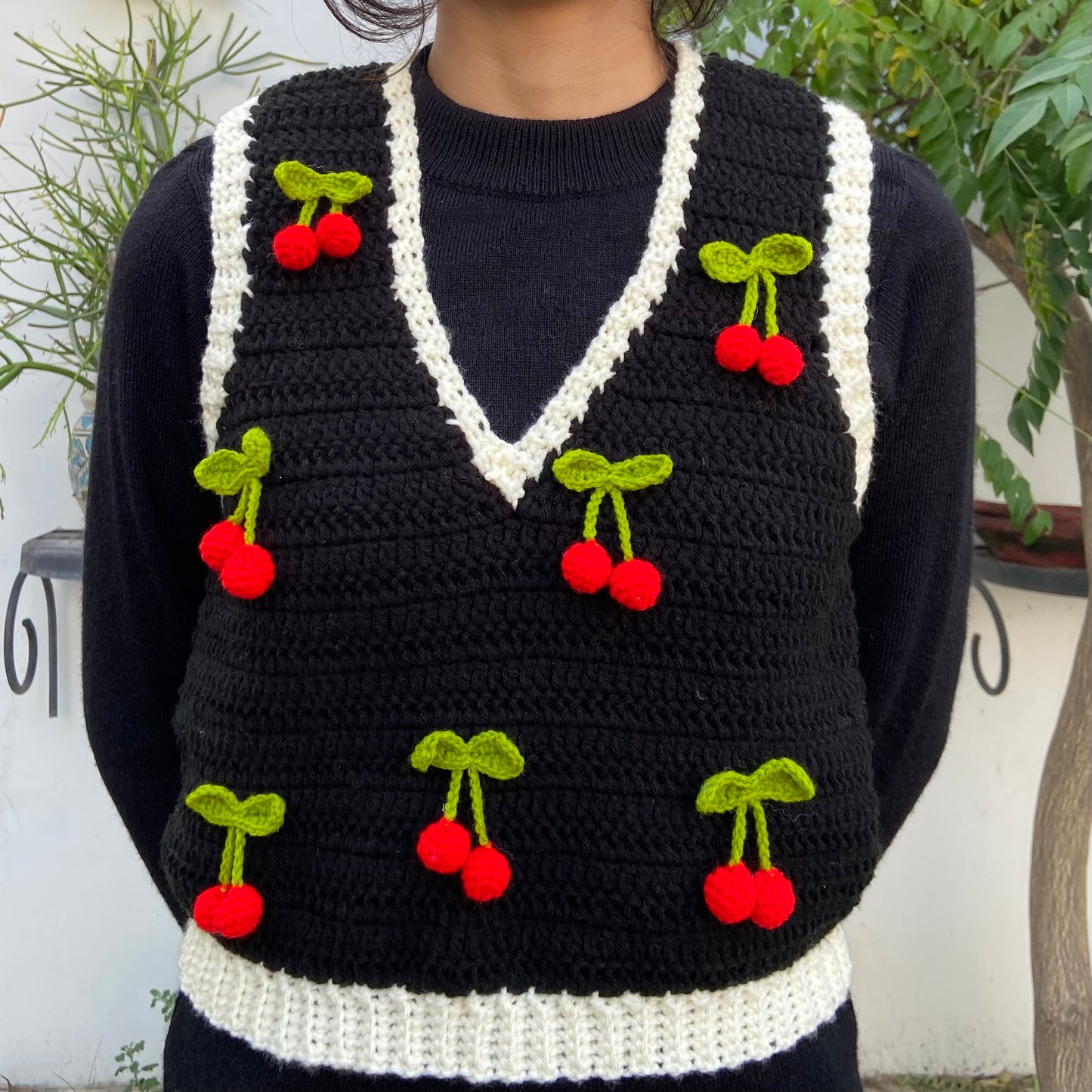 Black vest with cherries