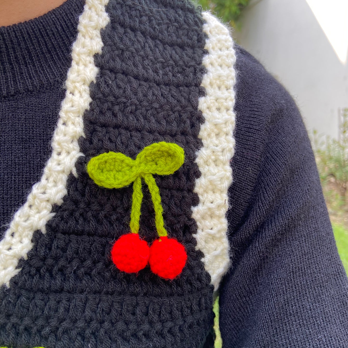 Black vest with cherries